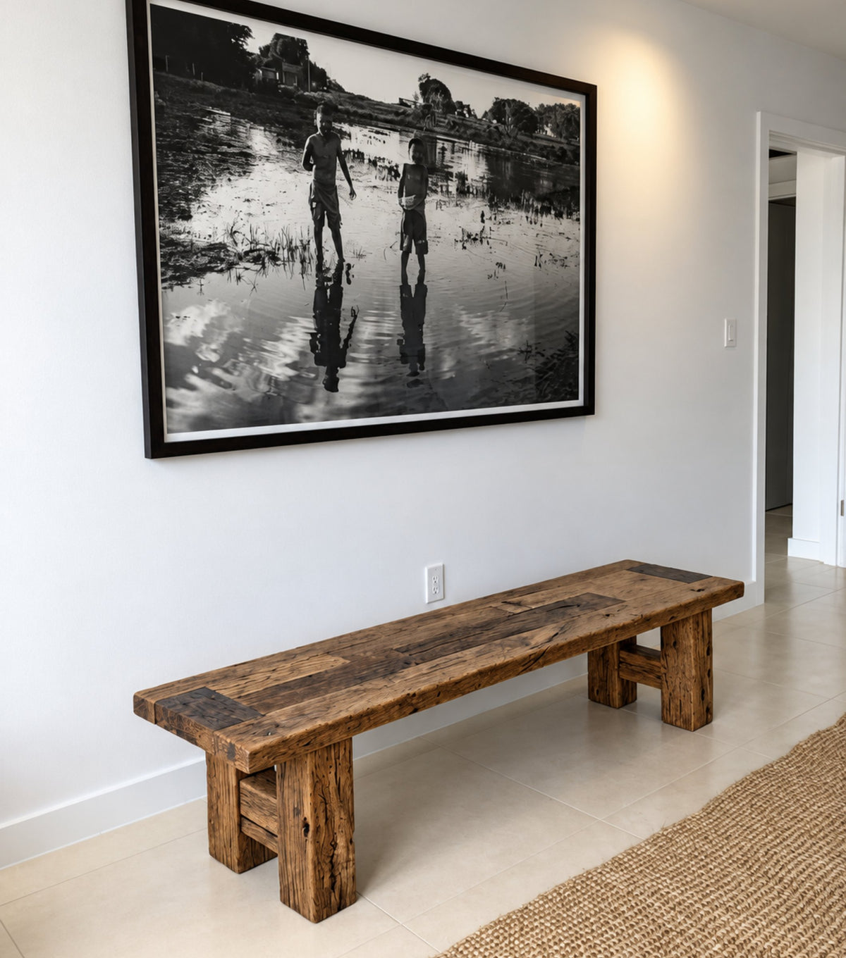 Plank Reclaimed Oak Bench – beneath a black-and-white photograph