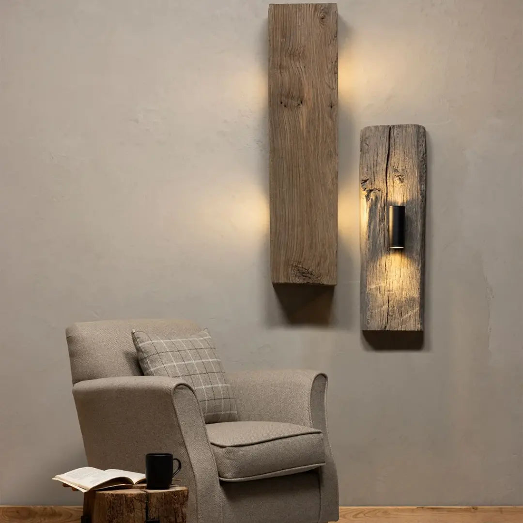 Reclaimed wood wall sconce with matte black spotlight on century-old Anatolian oak slab casting warm glow