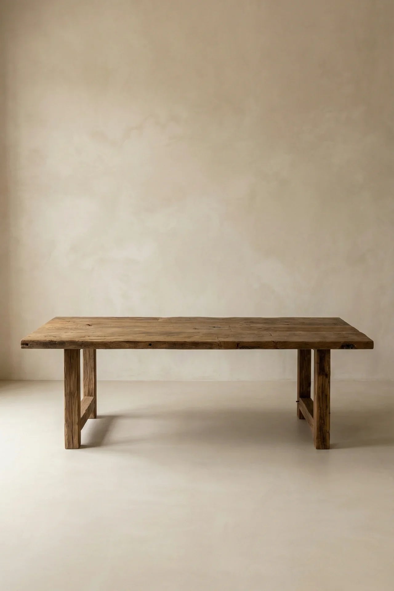 The surface was lifted from the planked walls of an old structure, given nothing more than a light brush, then left alone. The legs came from the same building's load-bearing beams. 