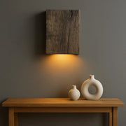 Reclaimed oak wall sconce in original dark finish with matte black spotlight