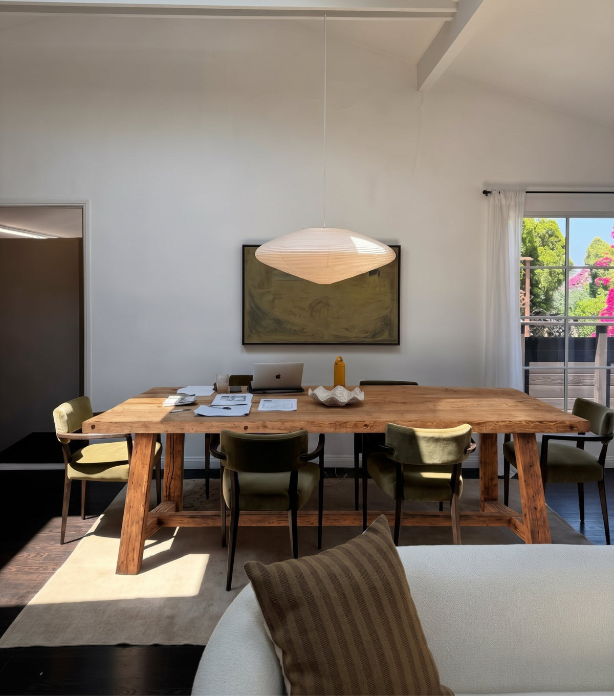 Agora Reclaimed Oak Dining Table – in an open-plan room with a sculptural pendant