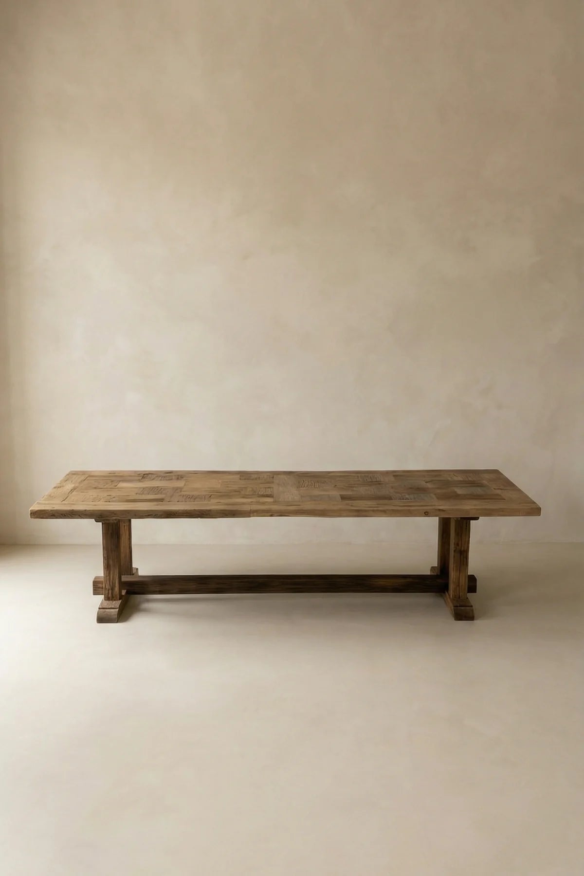 Archaia reclaimed oak dining table — three-quarter angle view highlighting grain and knot details