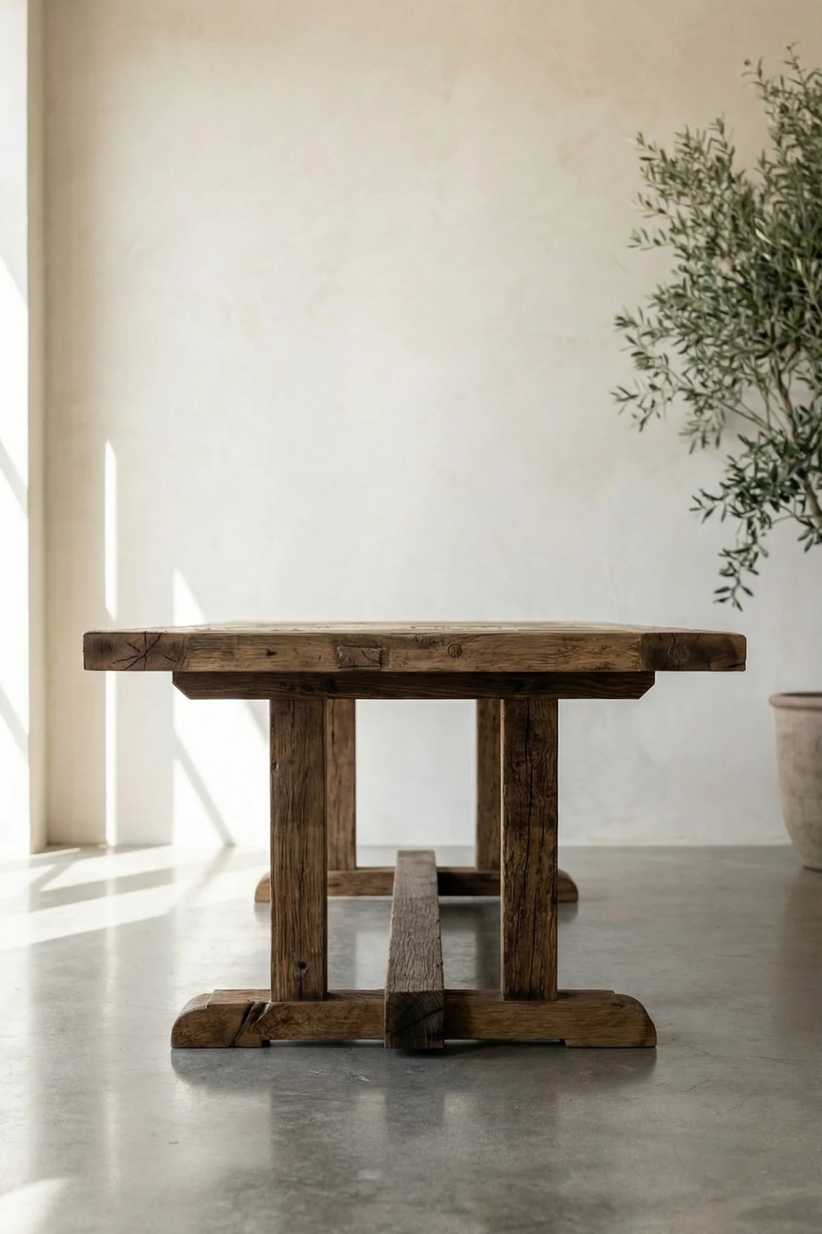 Structural beam leg of the Archaia dining table — reclaimed solid oak with natural character marks