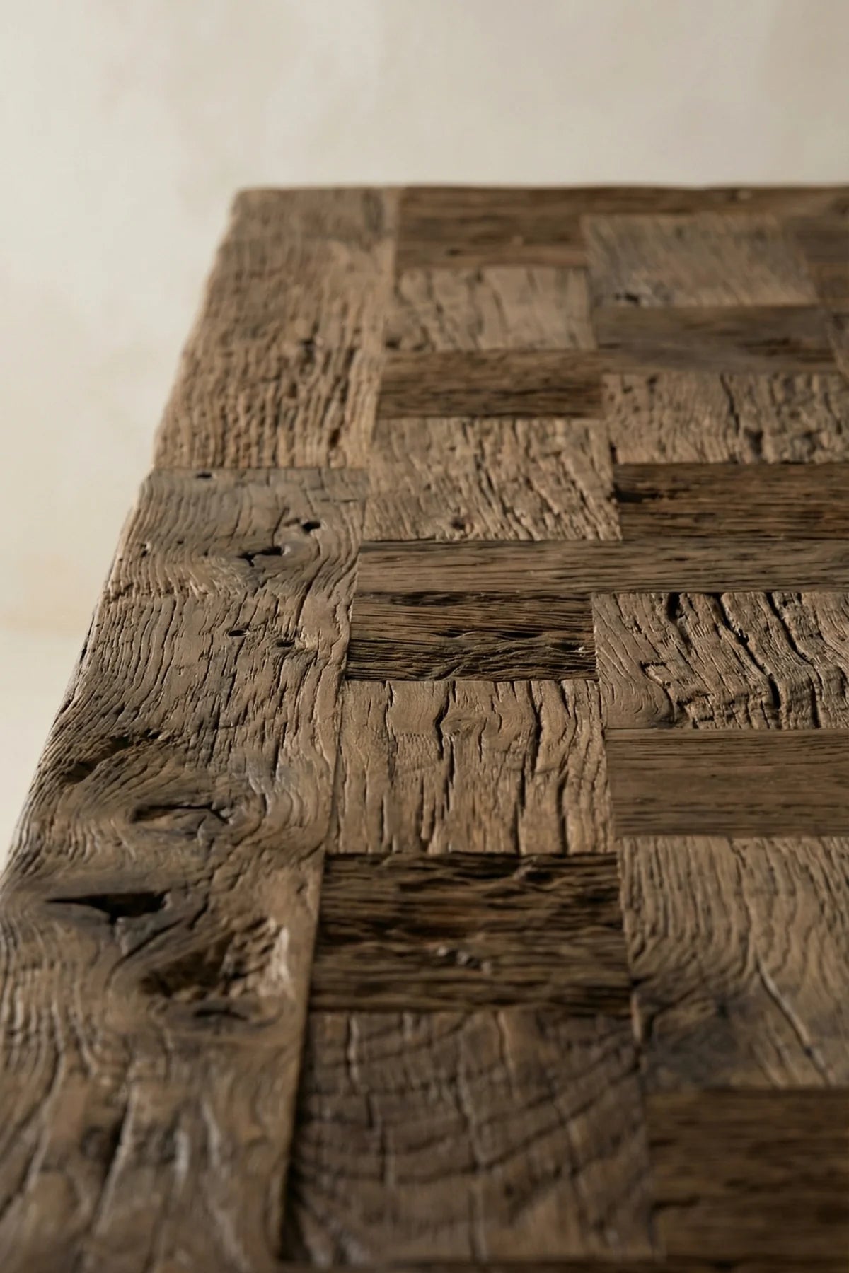 Top-down view of the Archaia reclaimed oak dining table showing surface plank construction