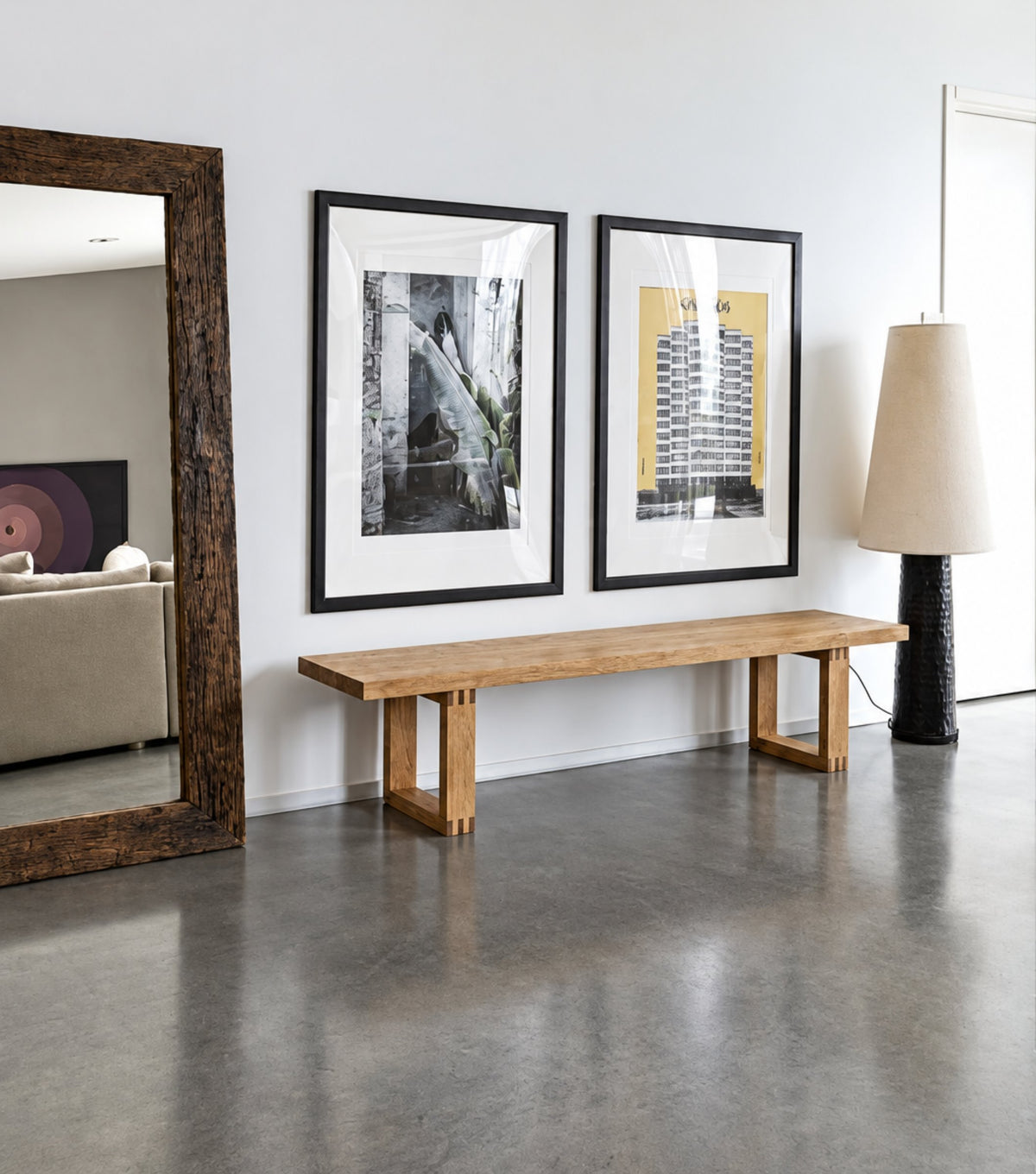 Doque Reclaimed Oak Bench – on a concrete floor beside a floor-standing mirror