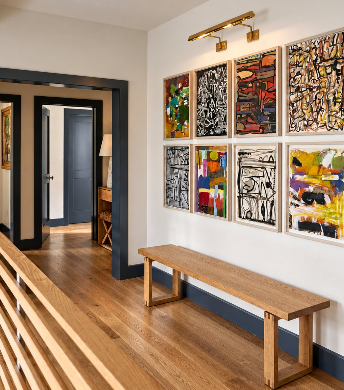 Doque Reclaimed Oak Bench – in a hallway with a gallery of abstract paintings
