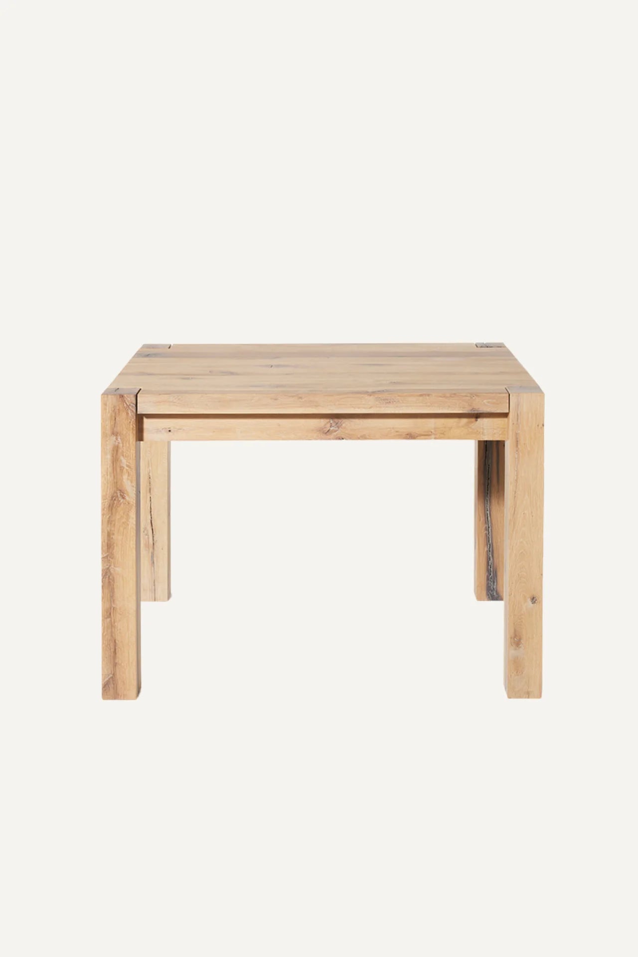 Driftwood reclaimed wood dining table front view with olive tree in a minimal contemporary interior