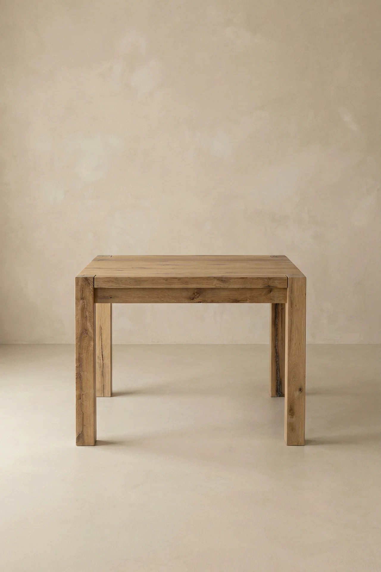 Driftwood dining table block leg and frame connection showing natural knot and weathered oak character