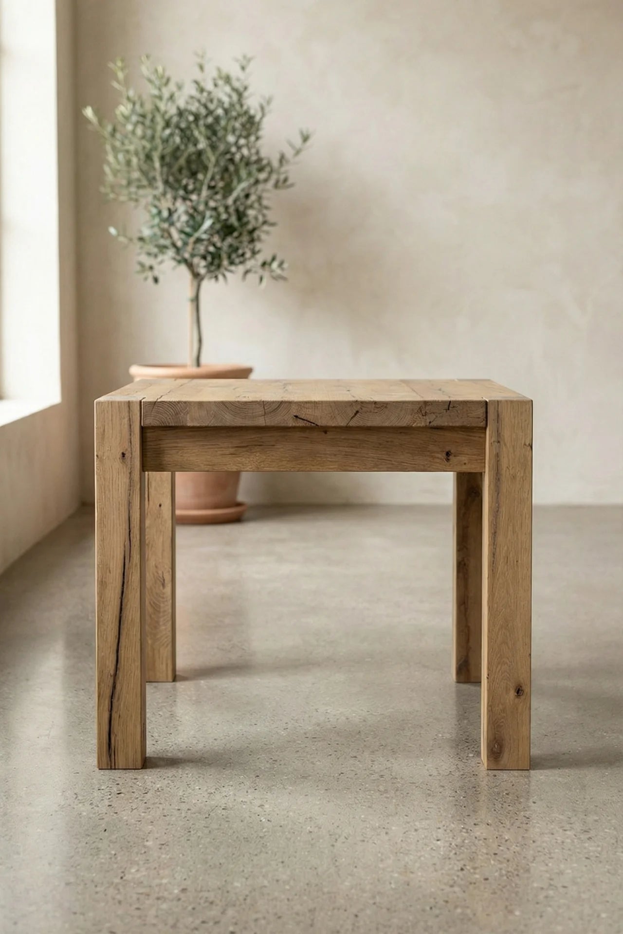 Reclaimed oak surface detail on the Driftwood dining table showing natural cracks and tonal variation