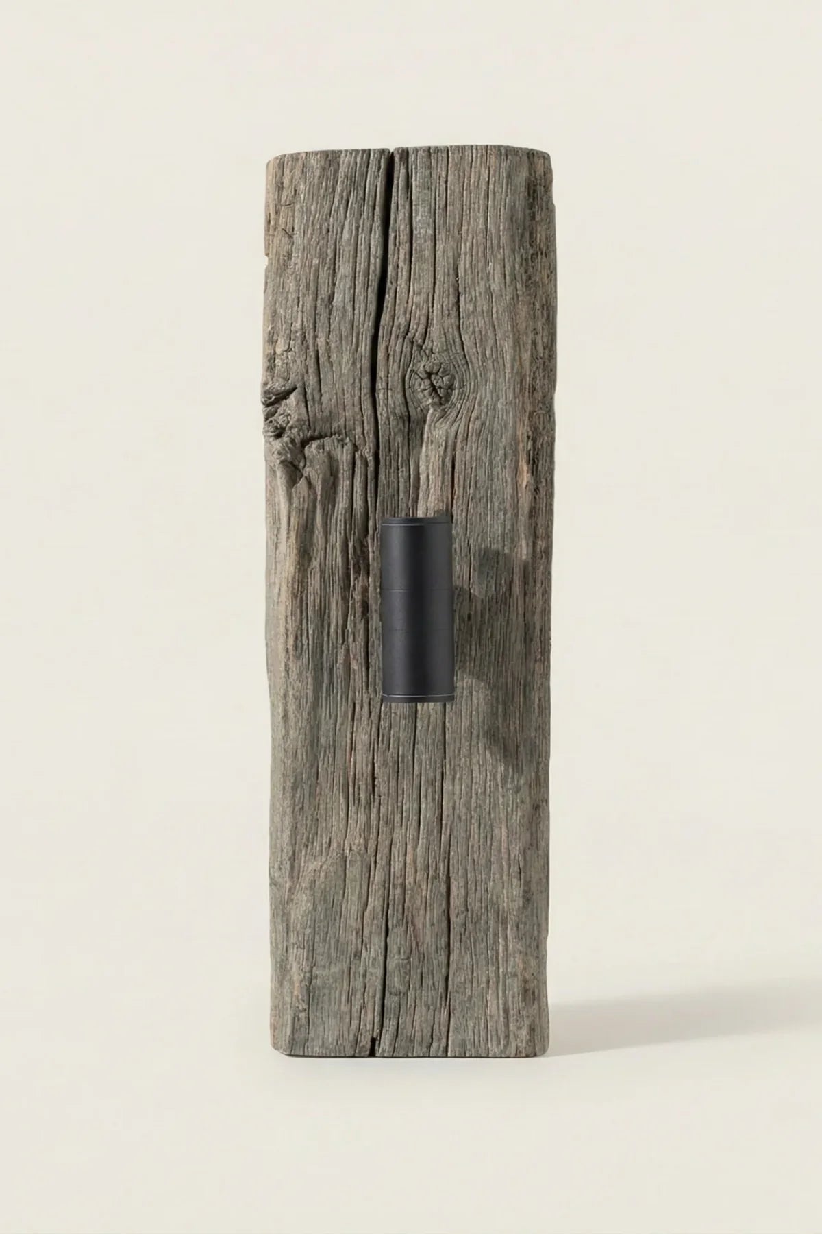 No.2 reclaimed oak wall light switched on — warm light against a wall