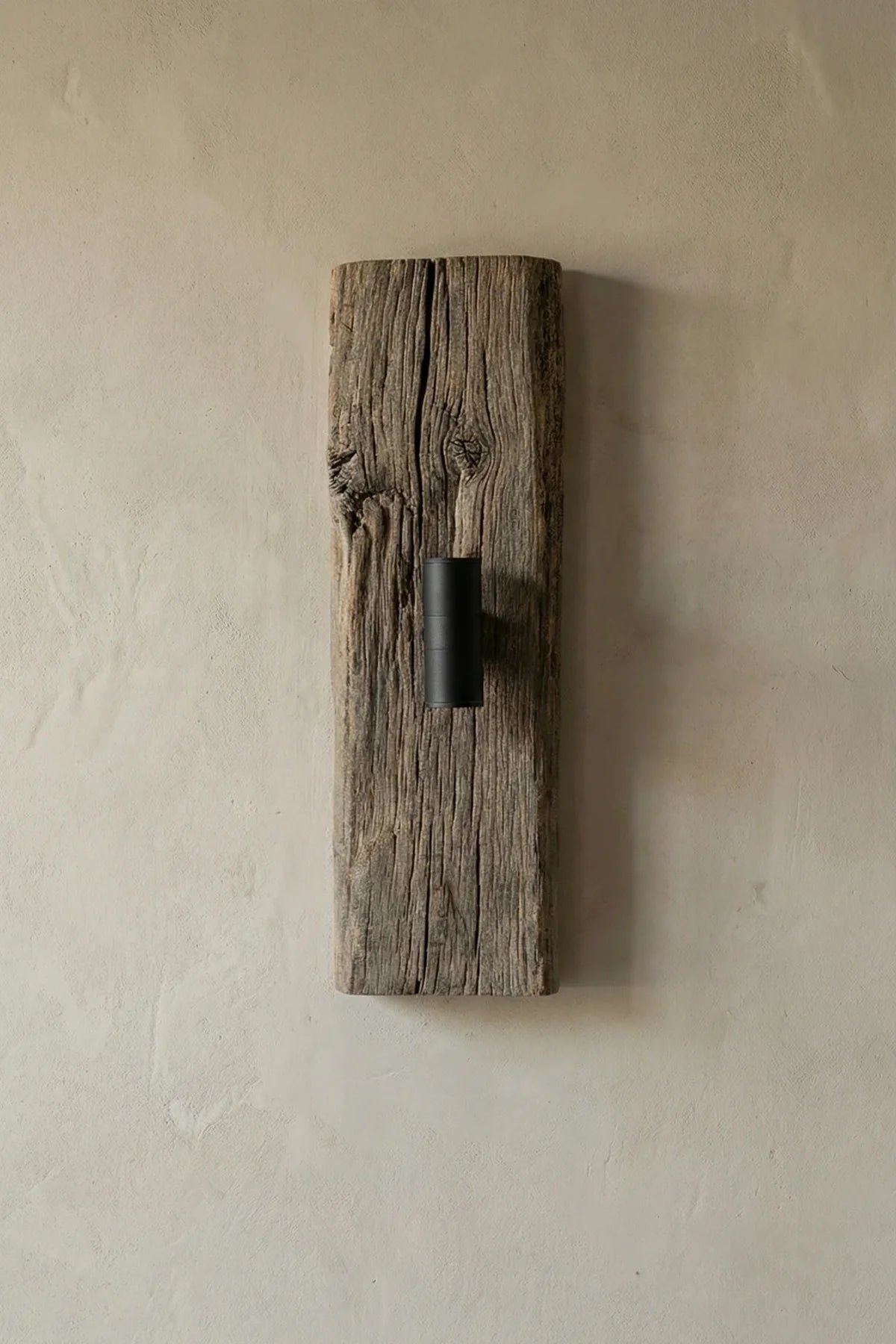 No.2 reclaimed oak wall light switched on — warm light against a wall
