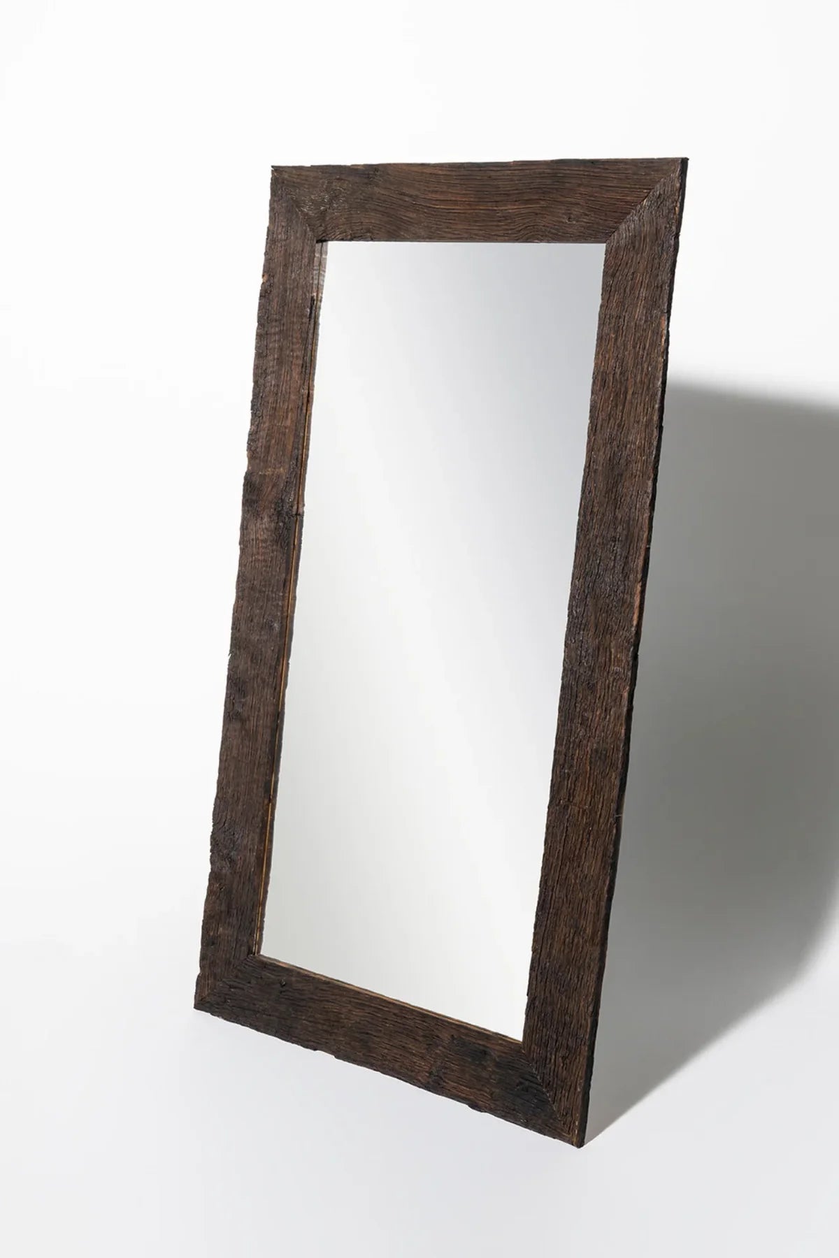 Close-up of reclaimed oak frame showing original weathered surface, grain, and natural tonal variation