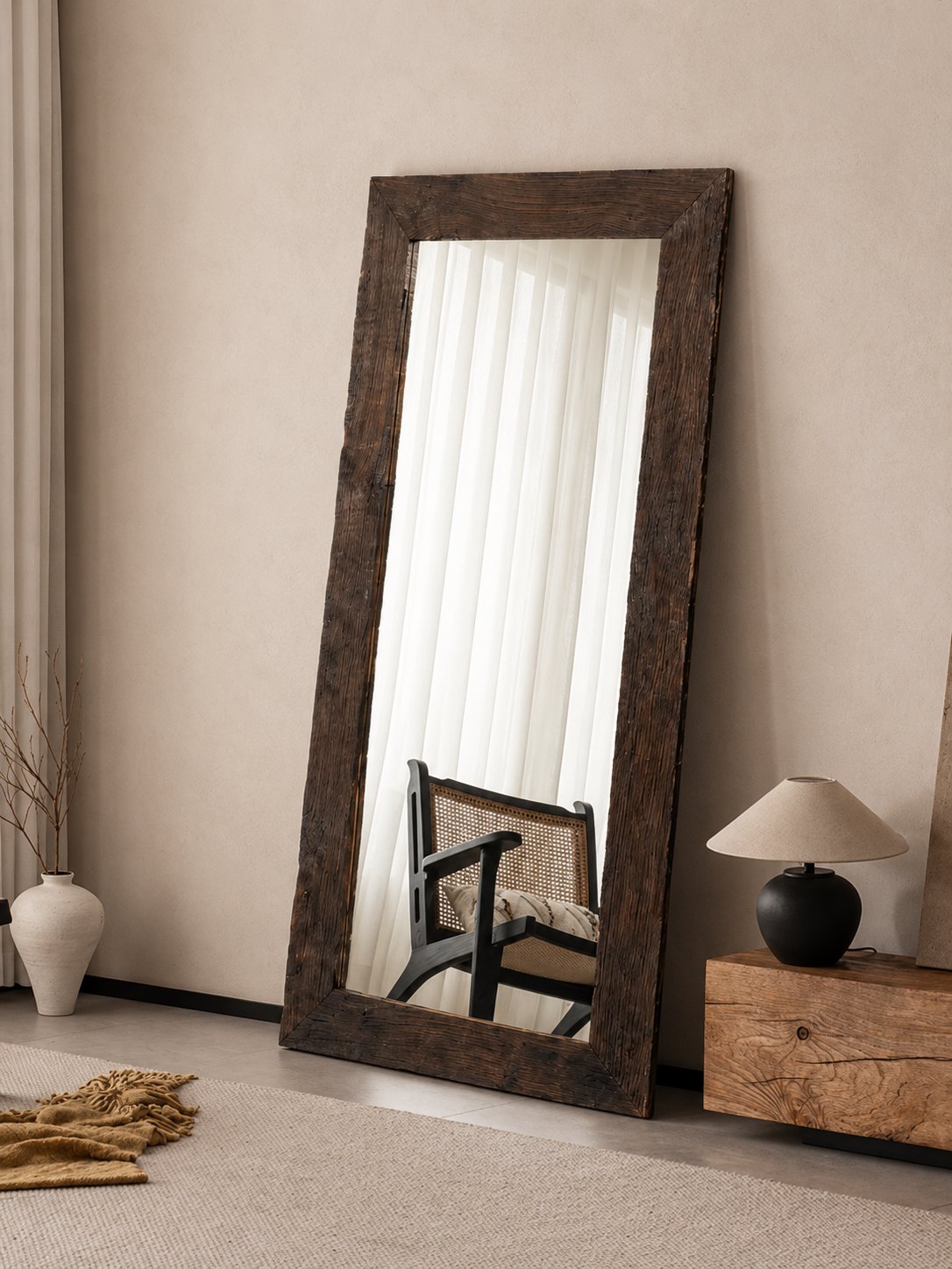 Oasis Reclaimed Oak Mirror – leaning against a wall in a bedroom
