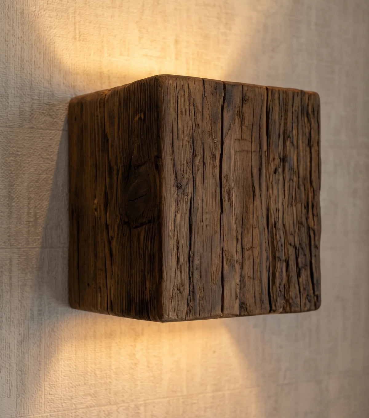 Reclaimed oak wall sconce, original dark finish – Small, 15 × 15 cm – close-up, lit