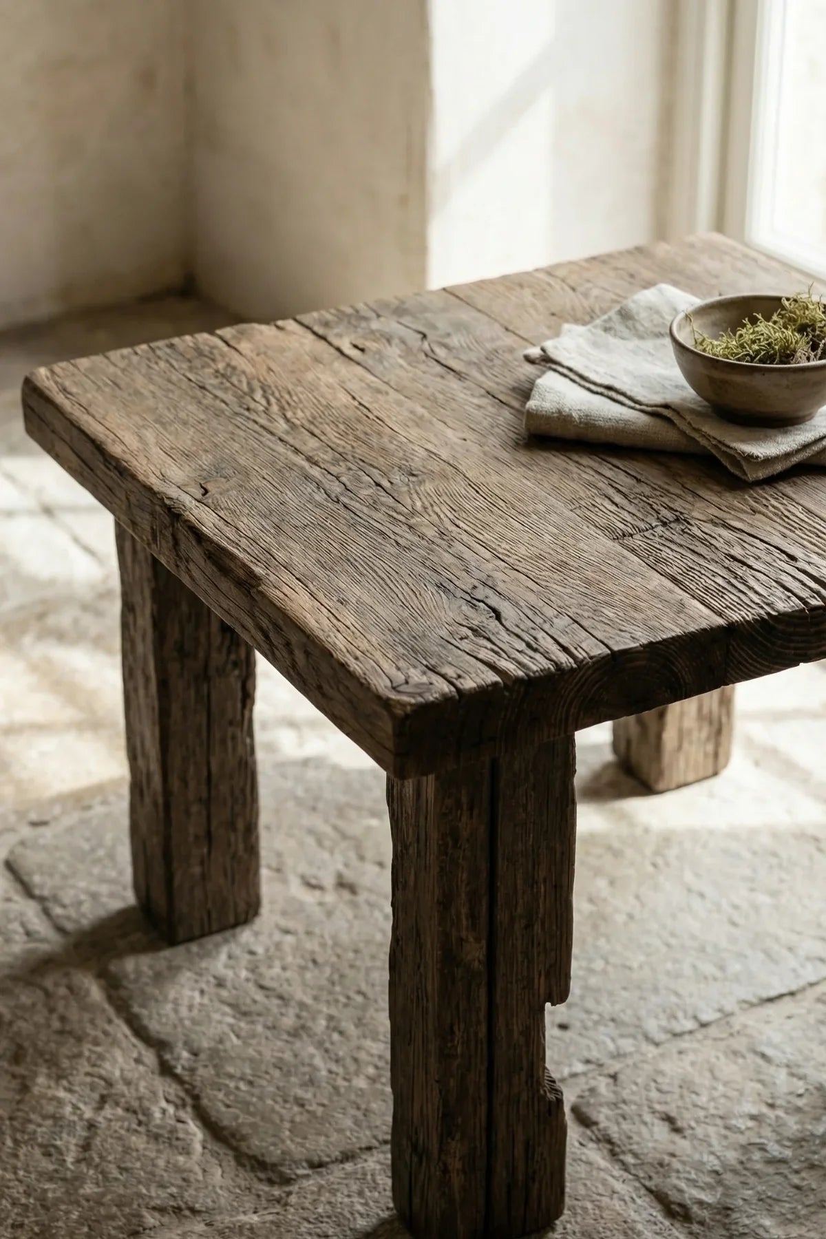 Close-up of Ostia square tabletop surface showing lightly brushed reclaimed oak grain and natural character