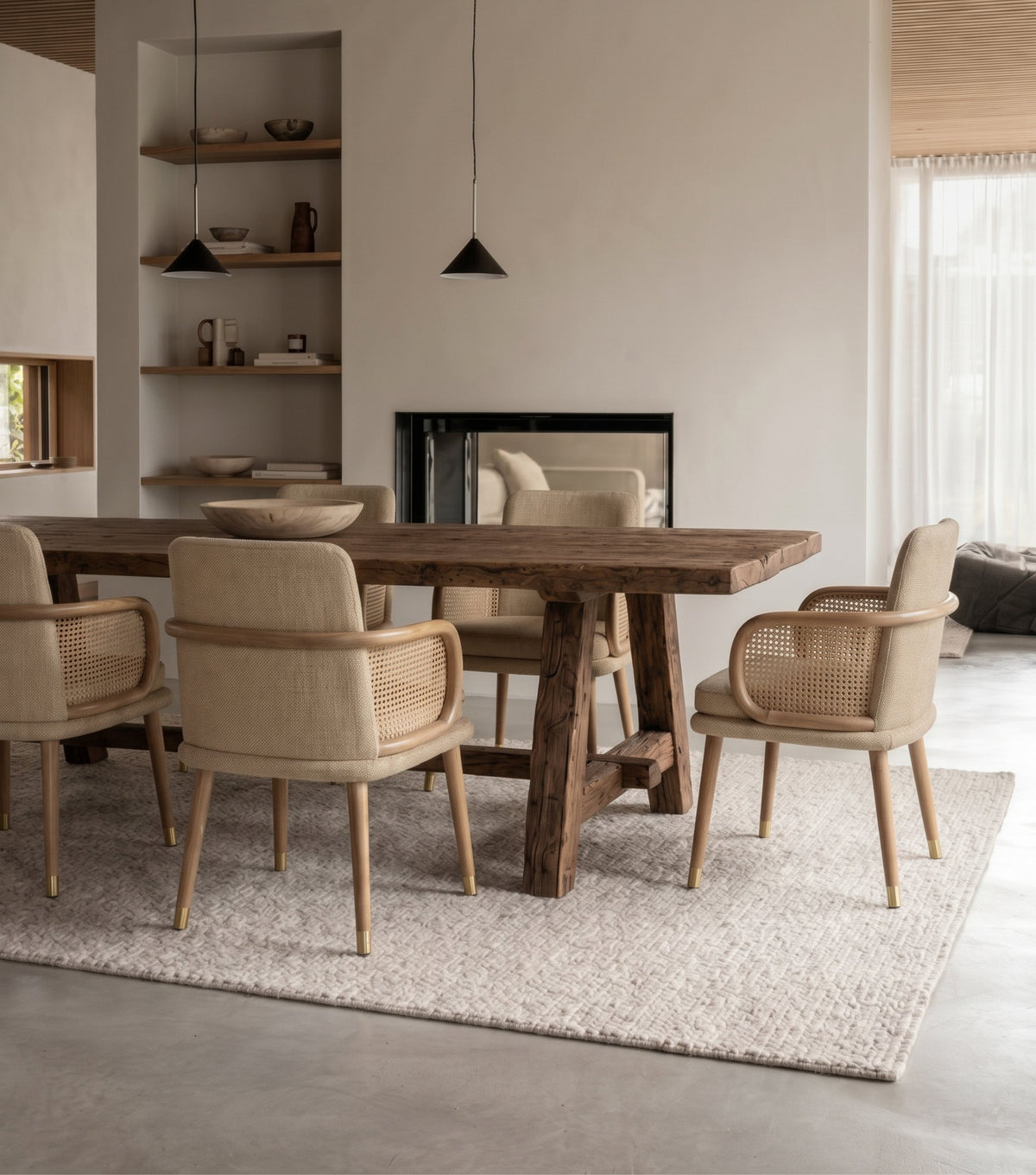 Perlas Reclaimed Oak Dining Table – with upholstered chairs beside a fireplace