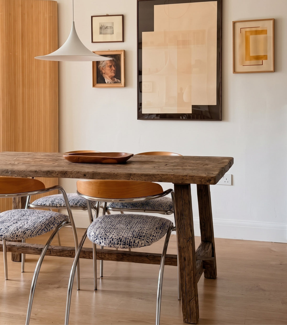 Perlas Reclaimed Oak Dining Table – with sheepskin chairs and abstract artwork