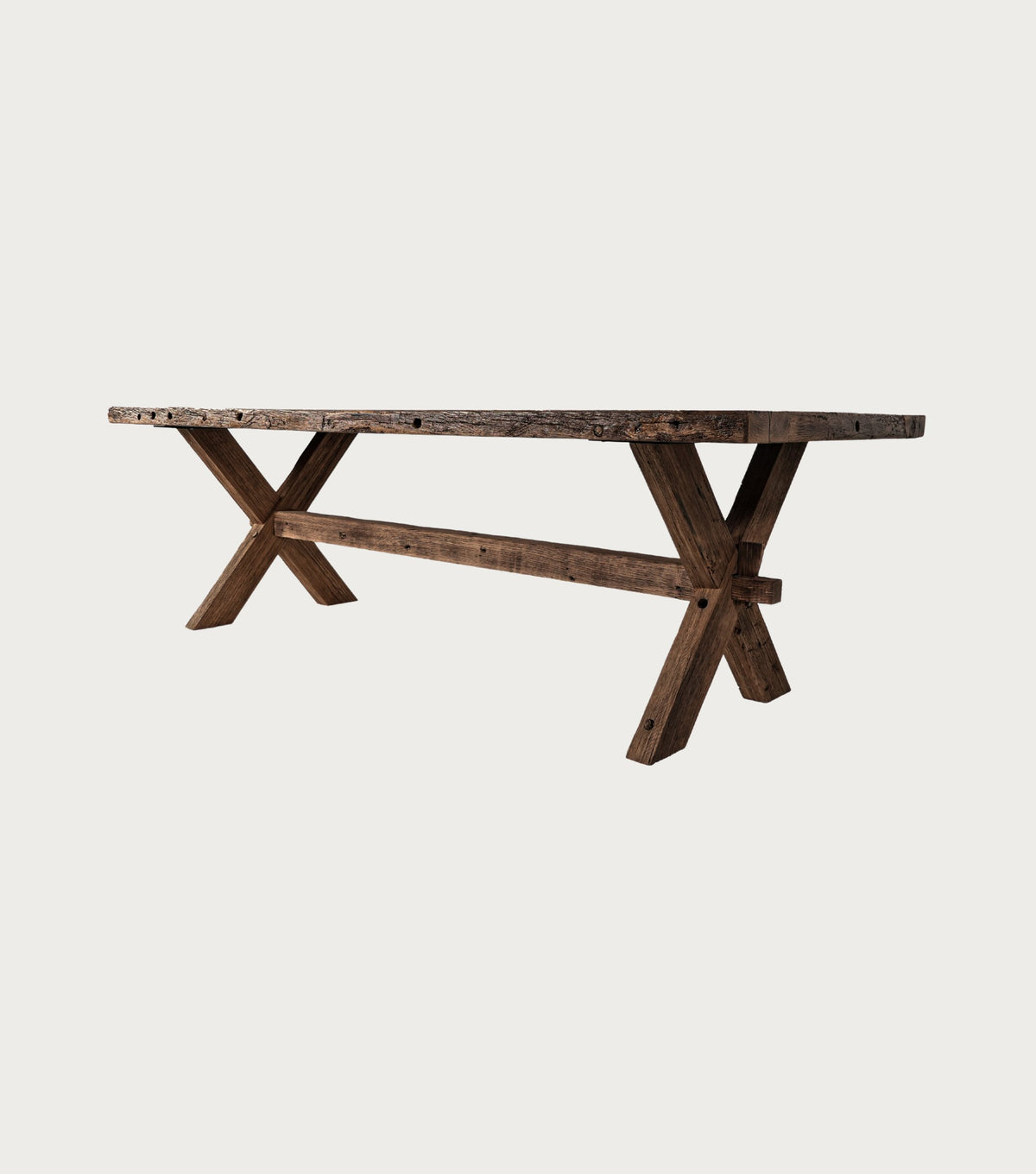 Petra Reclaimed Oak Herringbone Dining Table – three-quarter view of the X-trestle base