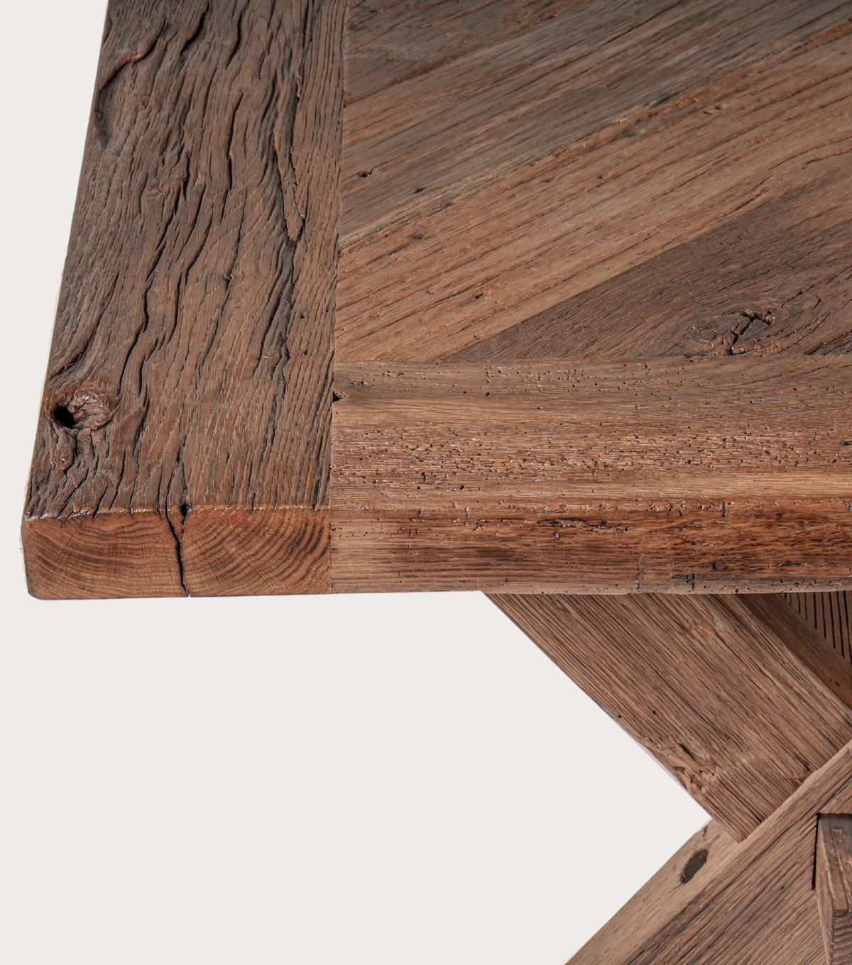 Petra Reclaimed Oak Herringbone Dining Table – corner detail of the frame and herringbone top