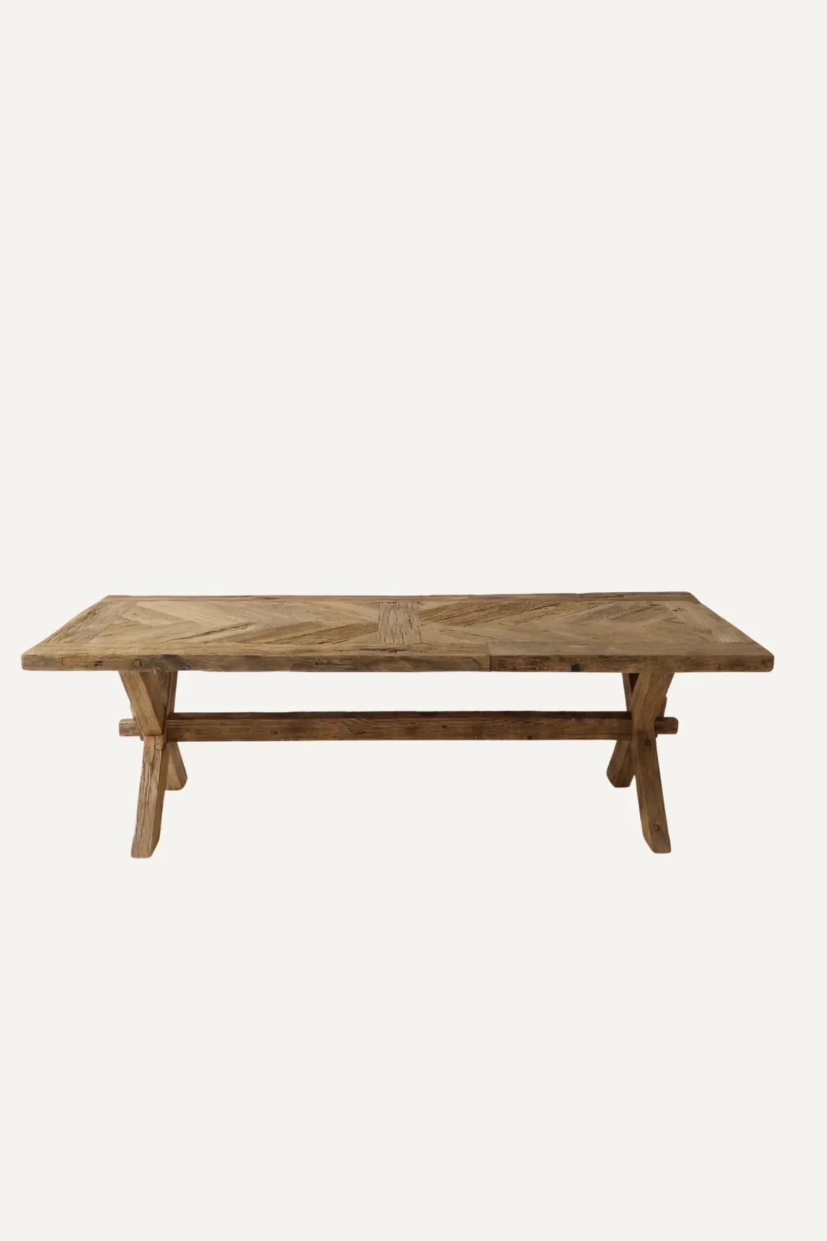 Petra reclaimed oak herringbone dining table — front view showing full herringbone tabletop pattern