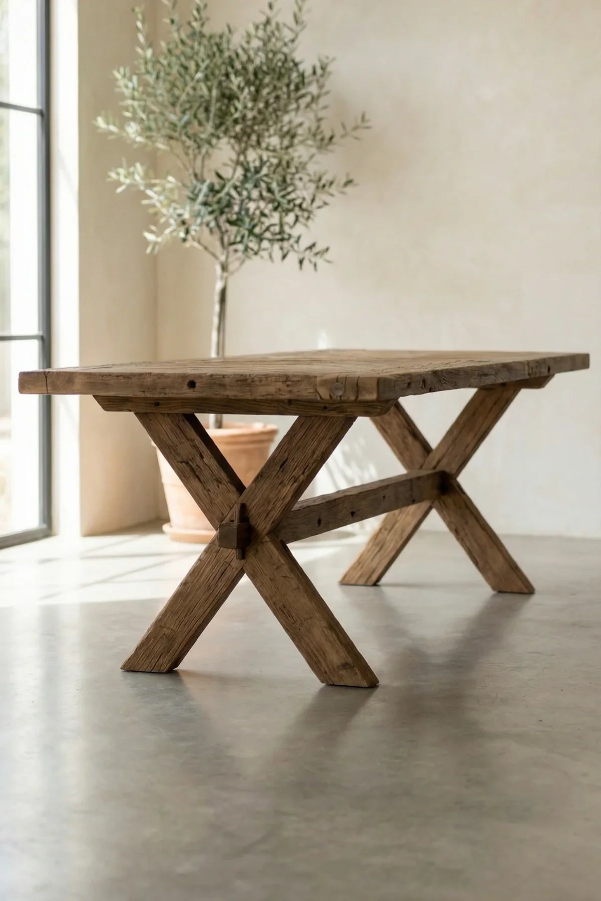 Structural reclaimed oak beam leg of the Petra dining table — natural surface with original character marks