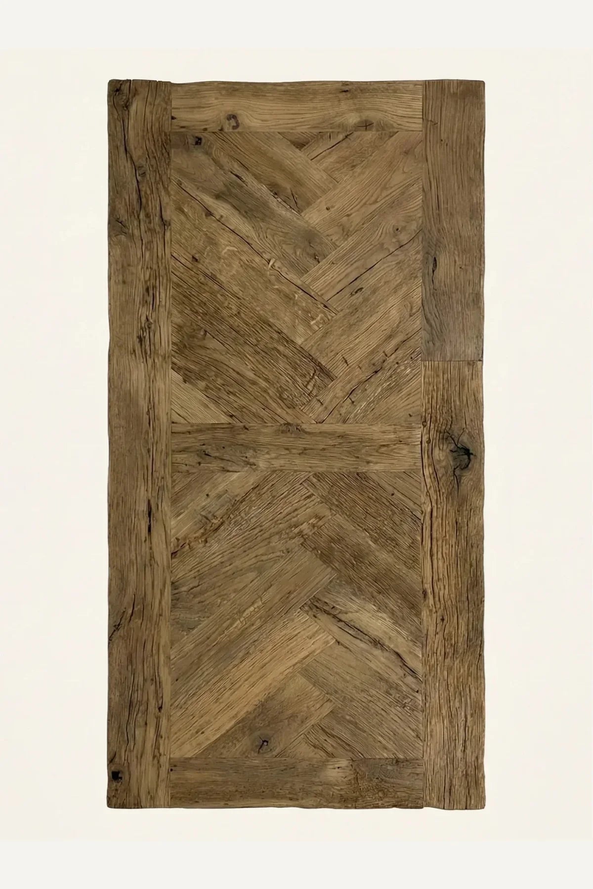 Detail of the hand-laid herringbone pattern on the Petra reclaimed oak dining table