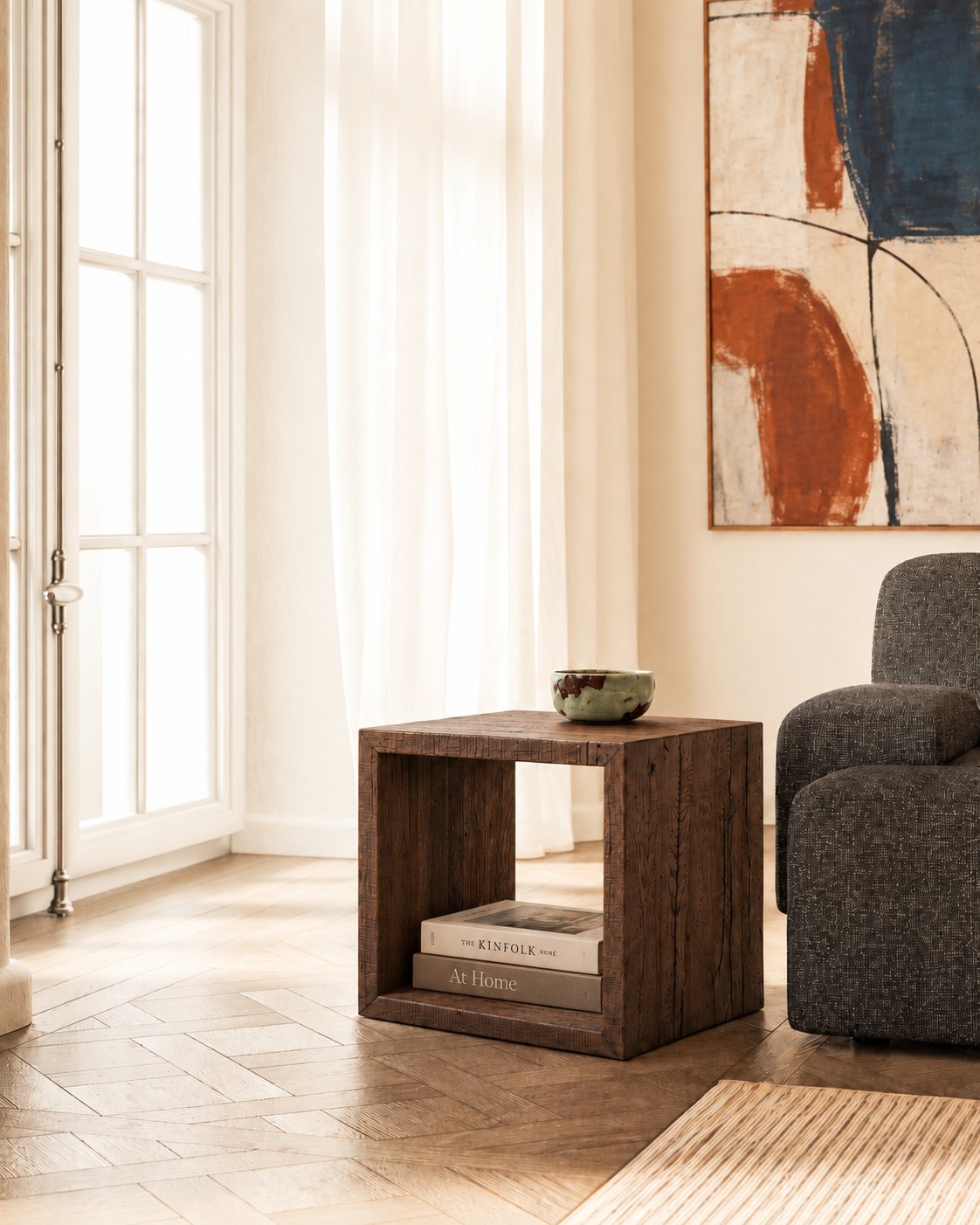 Sardis Reclaimed Oak Side Table – beside a grey armchair in a bright living room