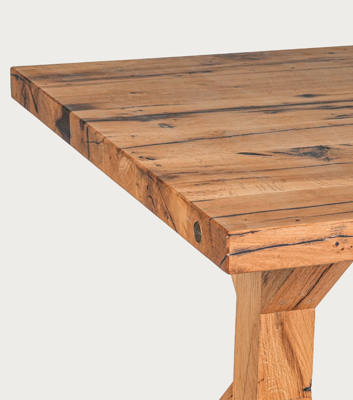 Serra Reclaimed Oak Dining Table – close-up of the plank top corner