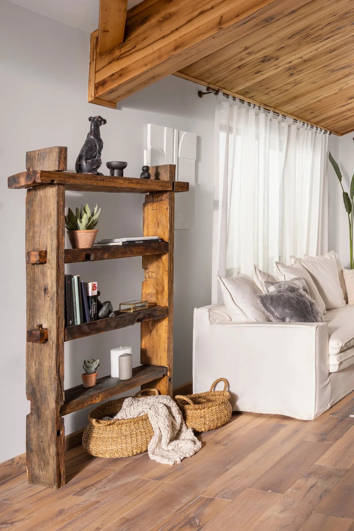 Solstice bookcase — three-quarter angle view showing traditional joinery and reclaimed oak surface