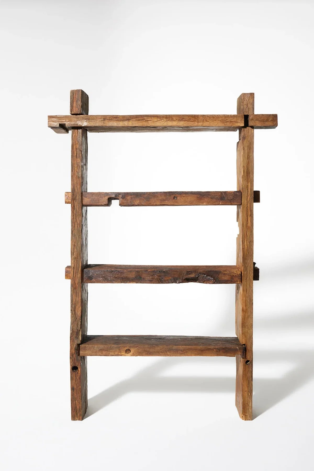 Full-height view of the Solstice reclaimed oak bookcase showing complete shelf configuration