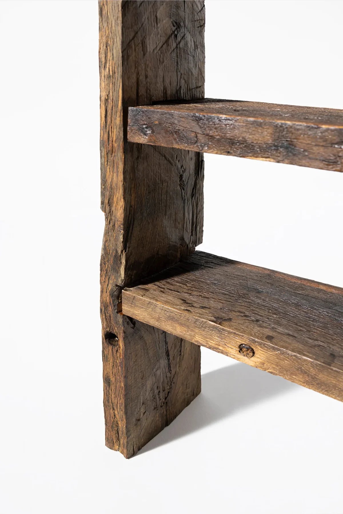 Leg and base detail of the Solstice freestanding reclaimed oak bookcase