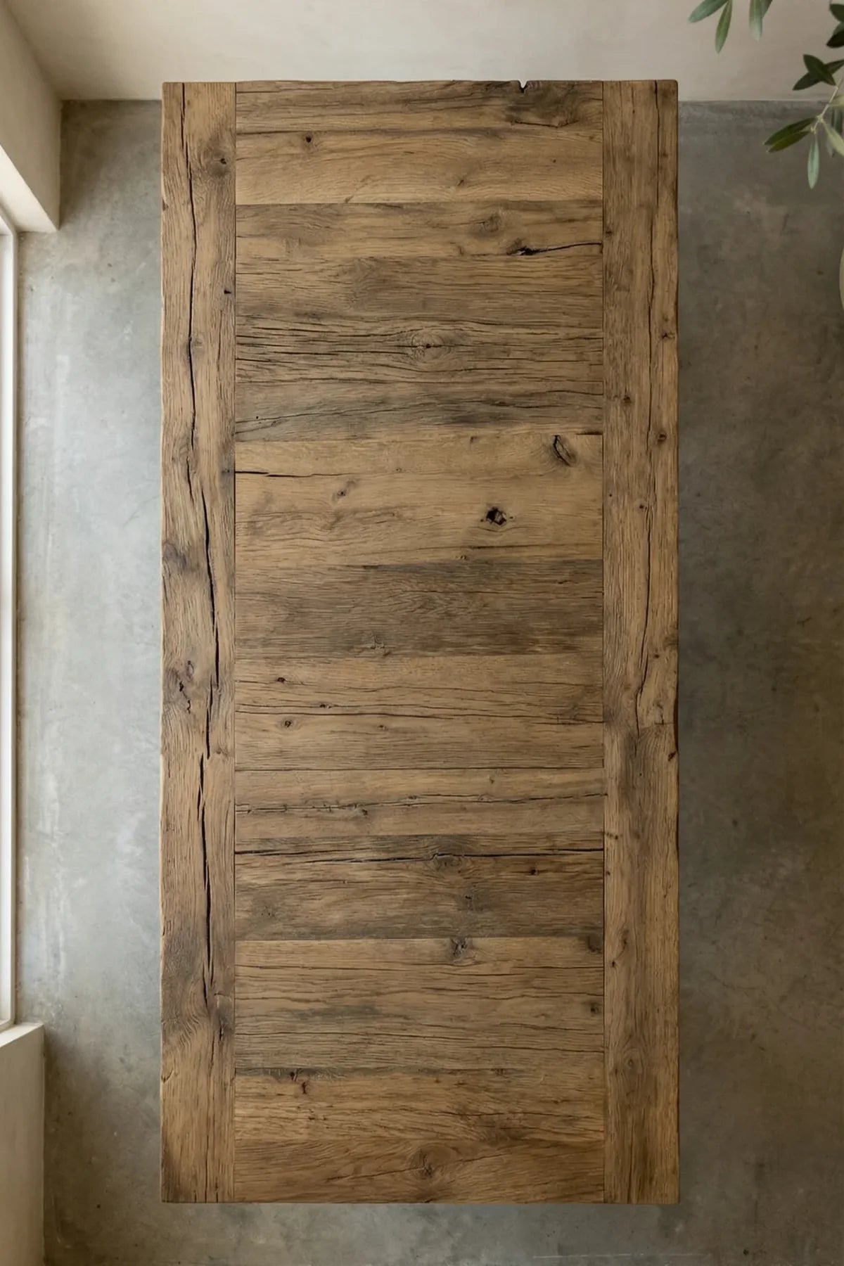 Top-down view of the Stoa dining table showing deep-brushed plank surface construction