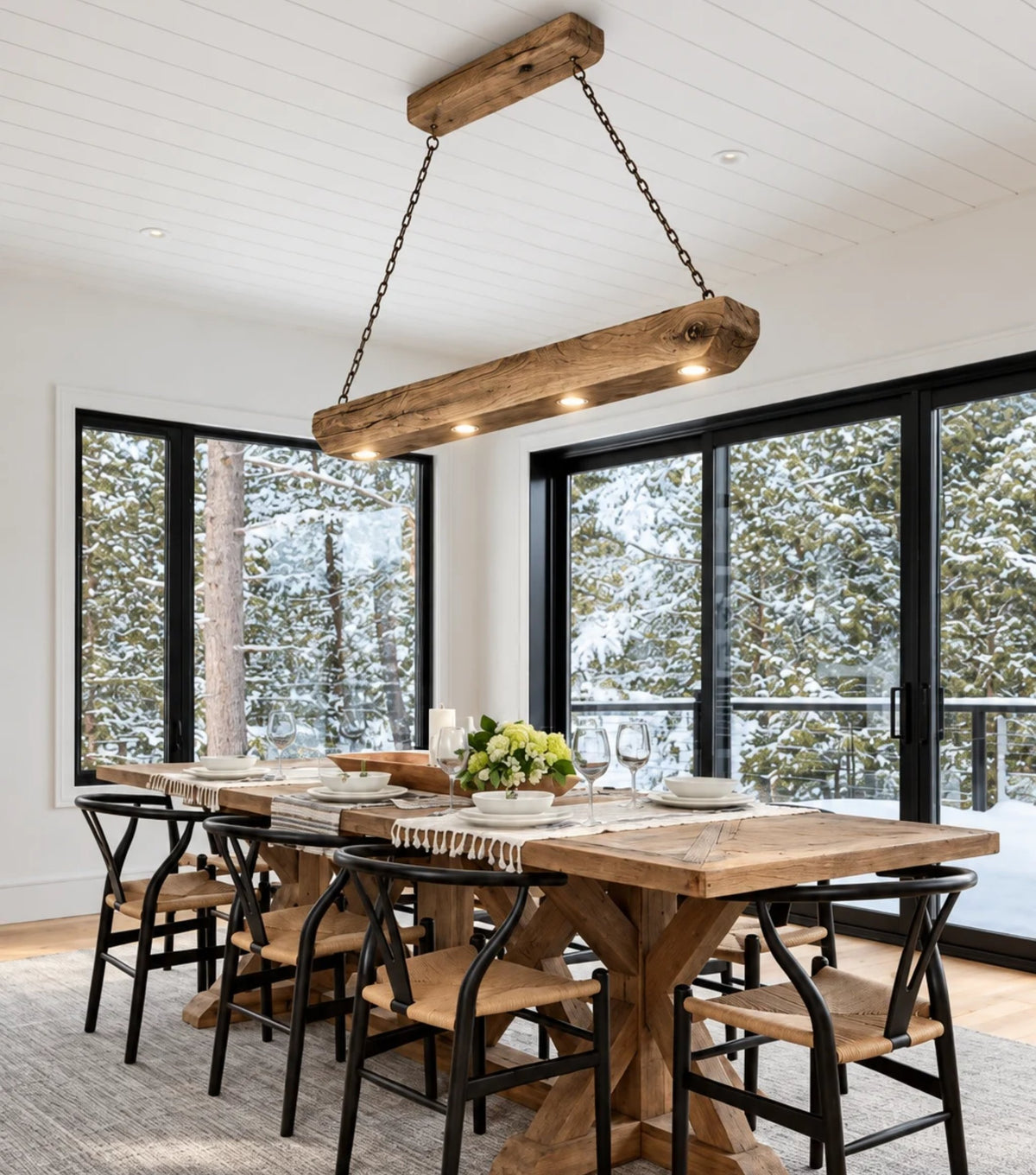 Tegmen Reclaimed Chestnut Beam Pendant Light – above a farmhouse dining table by large windows