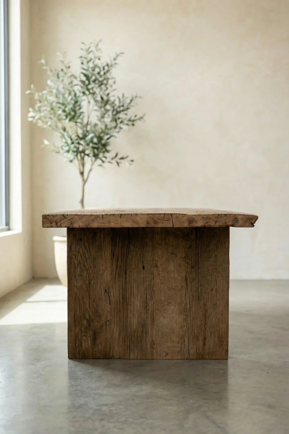 Side profile of the Thebes dining table showing apron and leg joinery