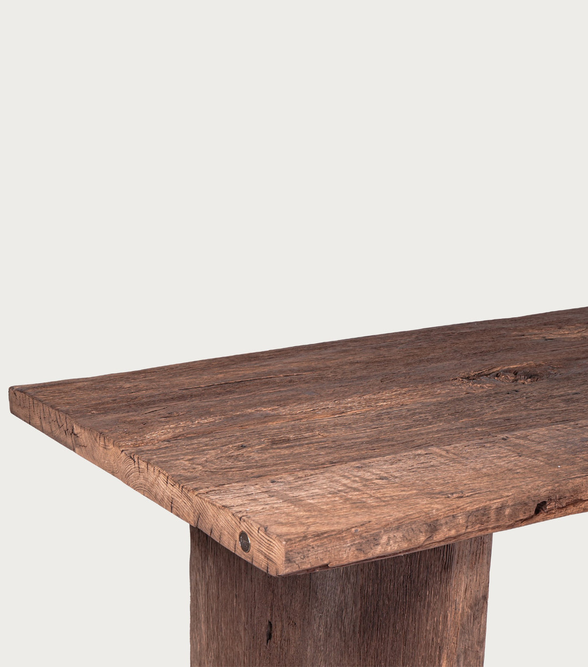 Thebes Reclaimed Oak Dining Table – detail of the thick top and panel leg
