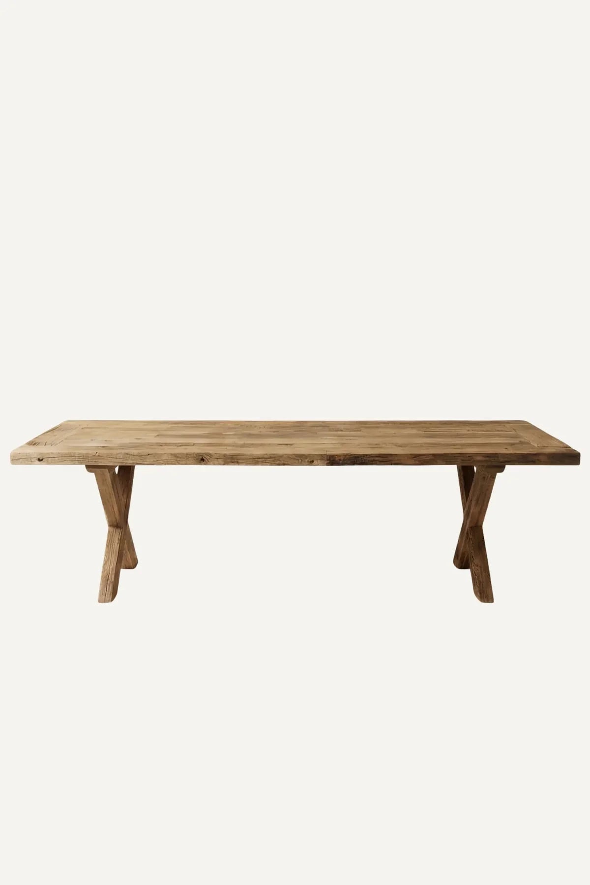 Traverse dining table — front view showing crossed leg base and reclaimed oak tabletop