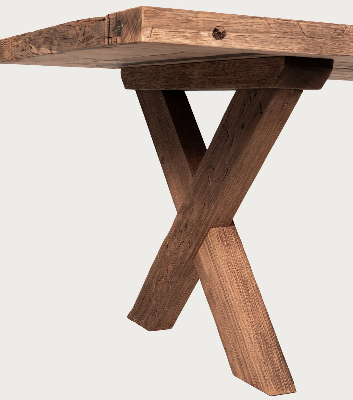 Traverse Reclaimed Oak Dining Table – detail of the crossed beam leg under the top